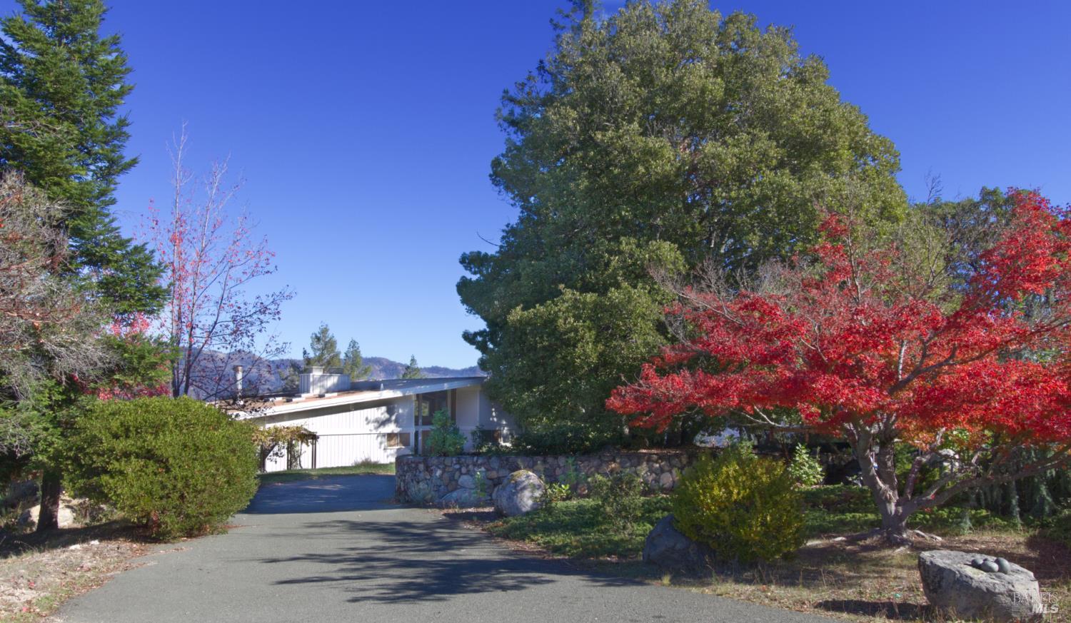 1755 Diamond Mountain Road Calistoga, CA 94515 - Photo 36 of 67 a front view of a house with a yard