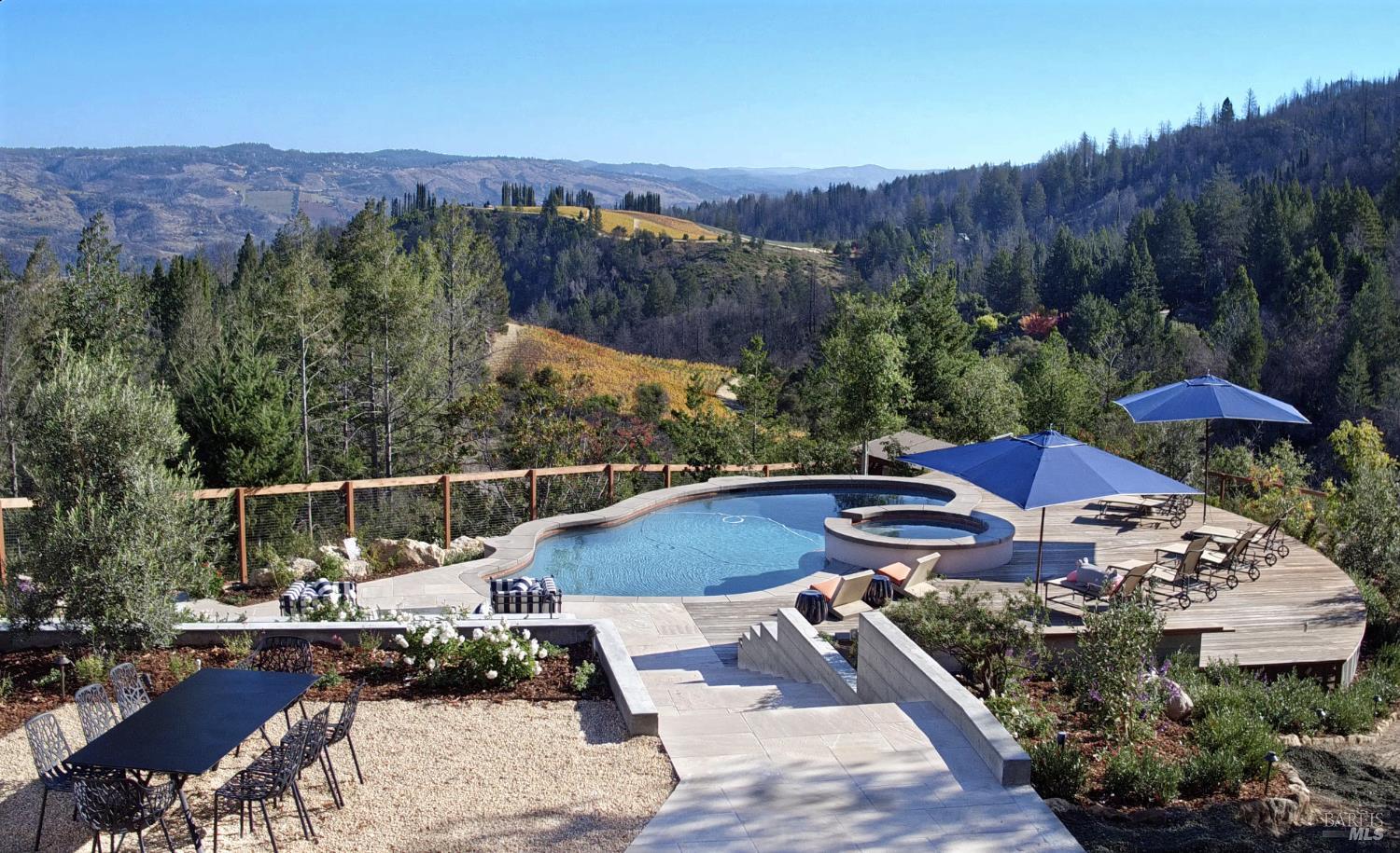 1755 Diamond Mountain Road Calistoga, CA 94515 - Photo 41 of 67 a view of a patio with furniture and a yard