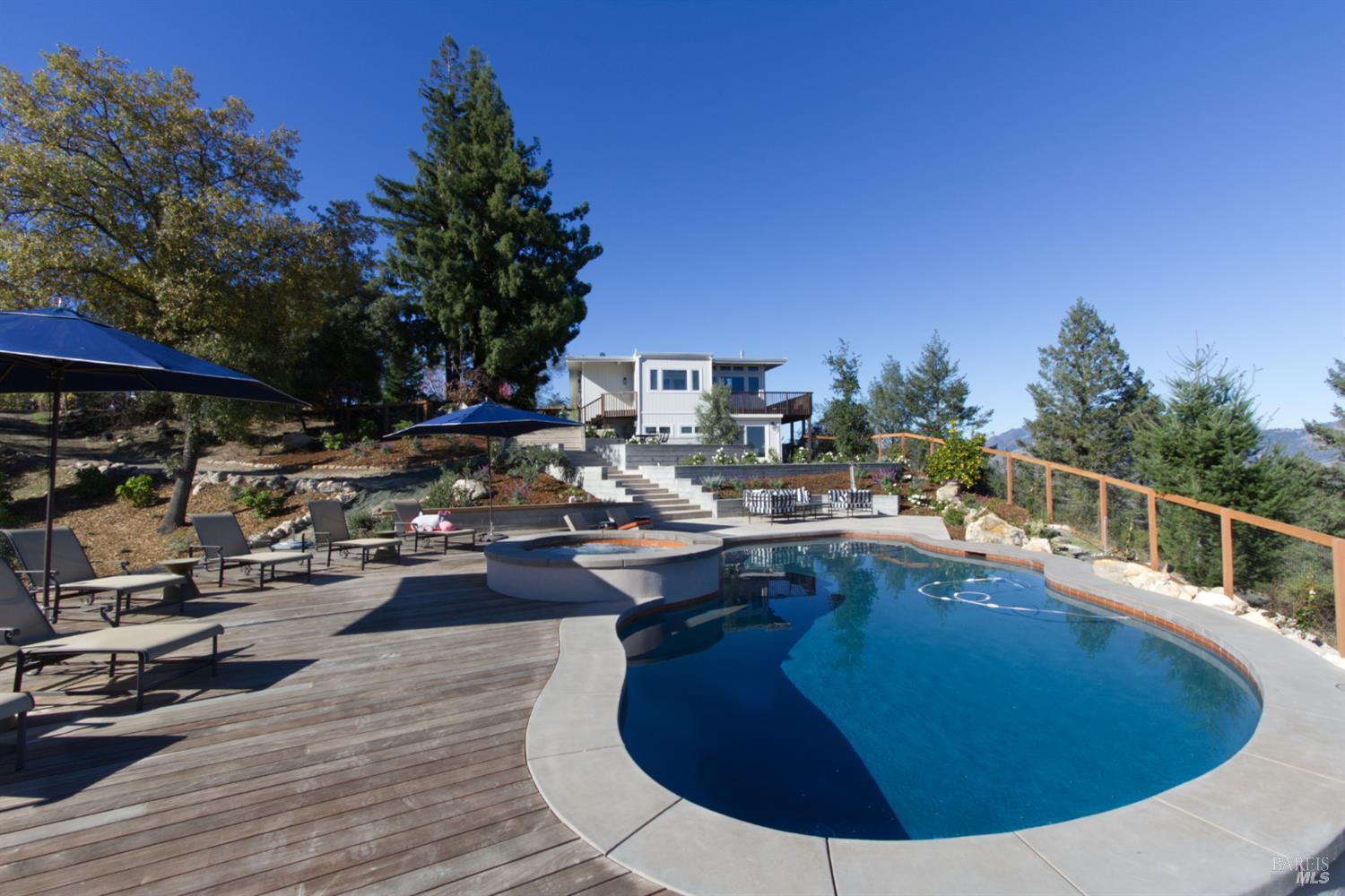 1755 Diamond Mountain Road Calistoga, CA 94515 - Photo 51 of 67 a view of a swimming pool with chairs