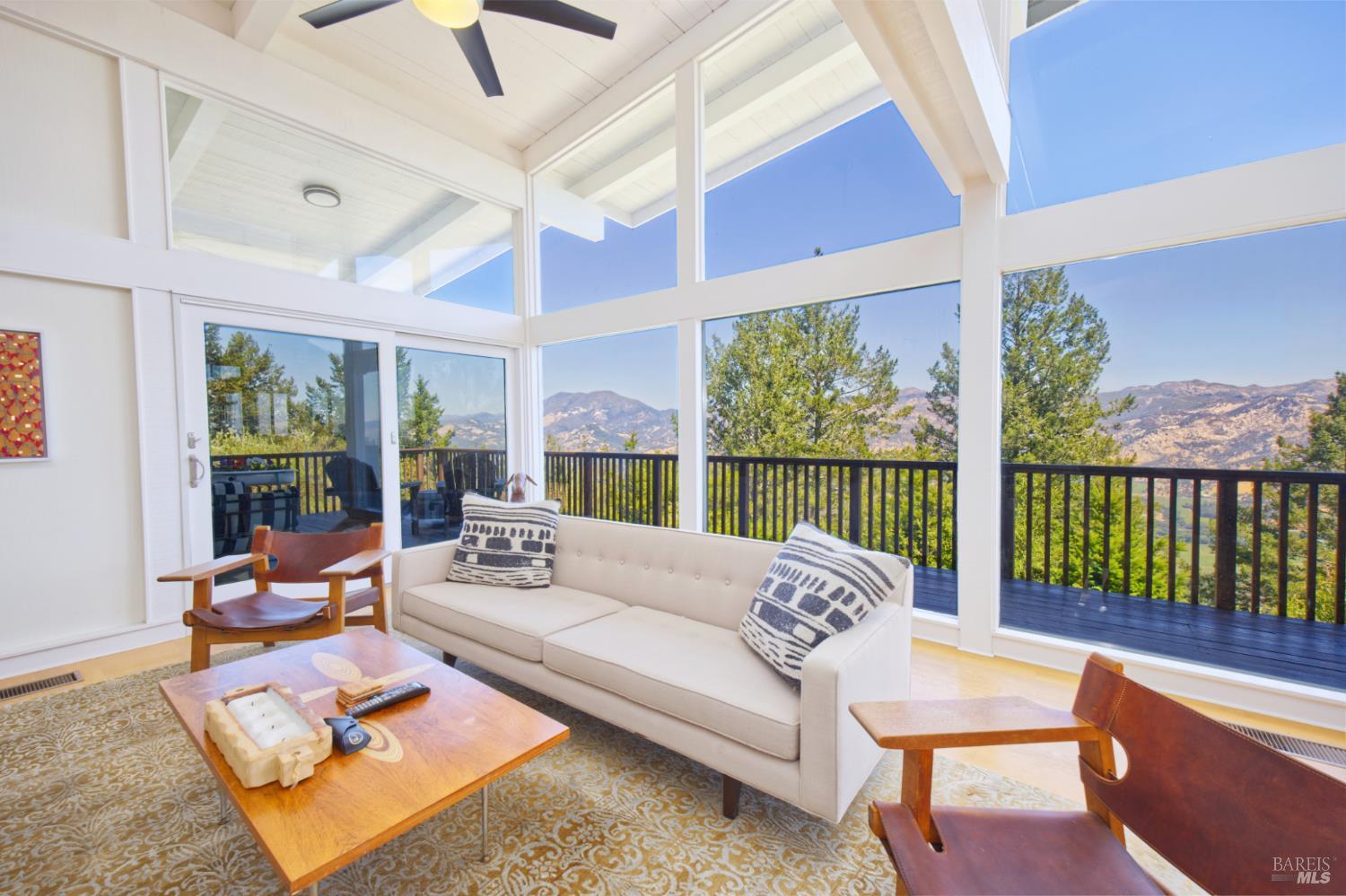 1755 Diamond Mountain Road Calistoga, CA 94515 - Photo 6 of 67 a living room with furniture and a large window