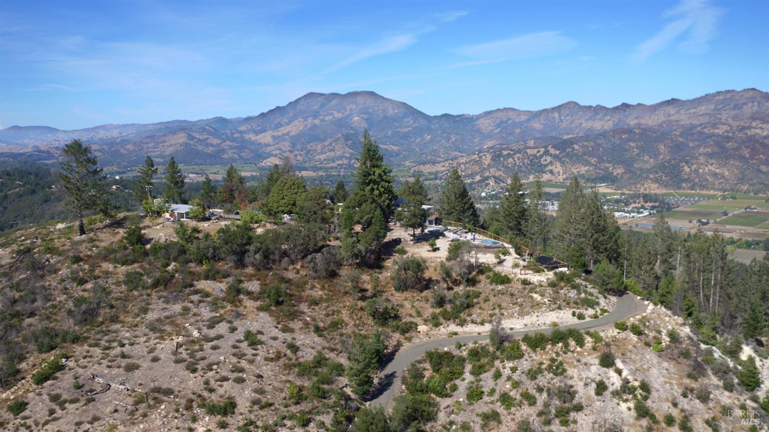 1755 Diamond Mountain Road Calistoga, CA 94515 - Photo 63 of 67 a view of a lake in middle of forest