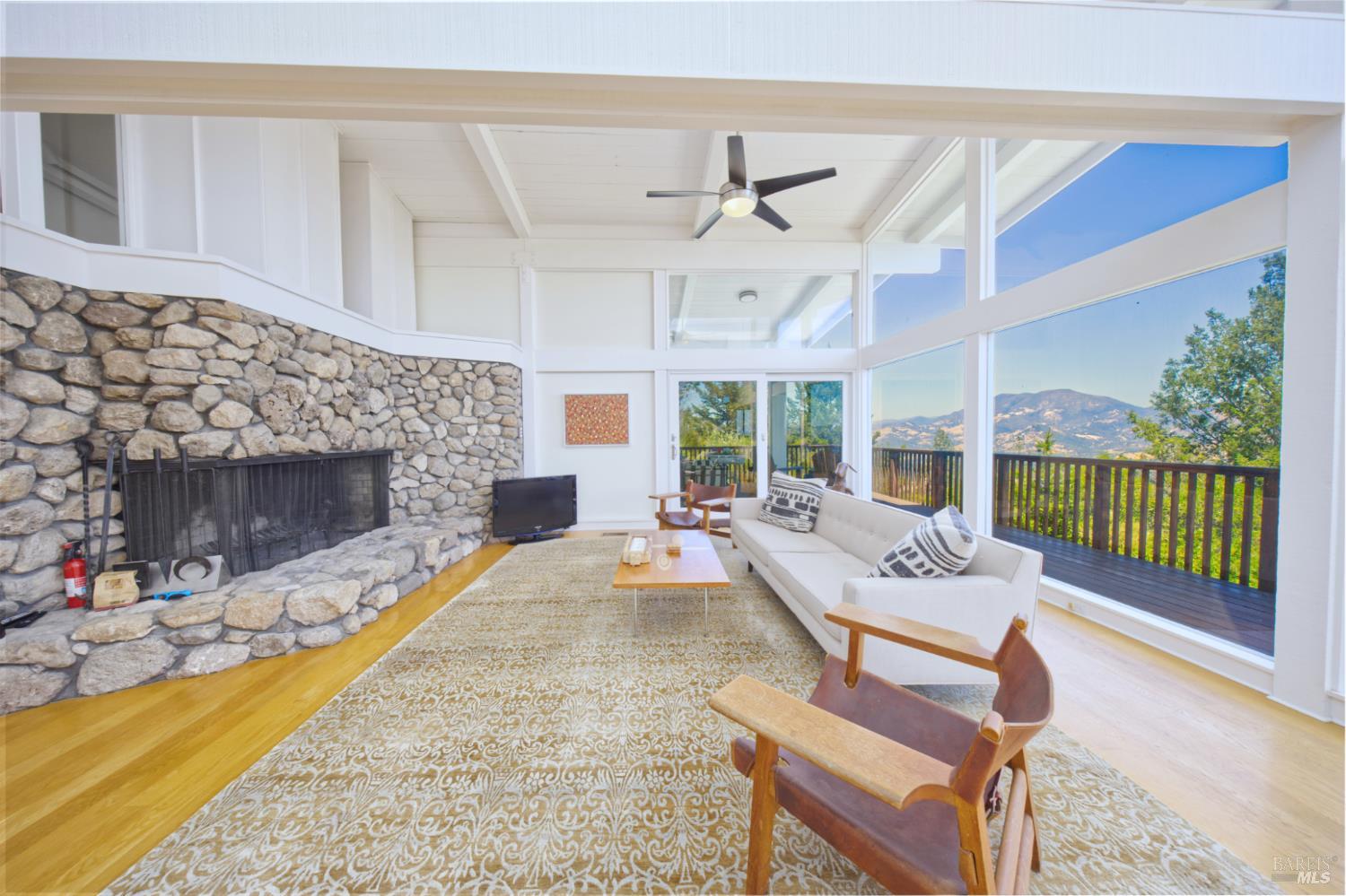 1755 Diamond Mountain Road Calistoga, CA 94515 - Photo 10 of 67 a living room with furniture and a fireplace