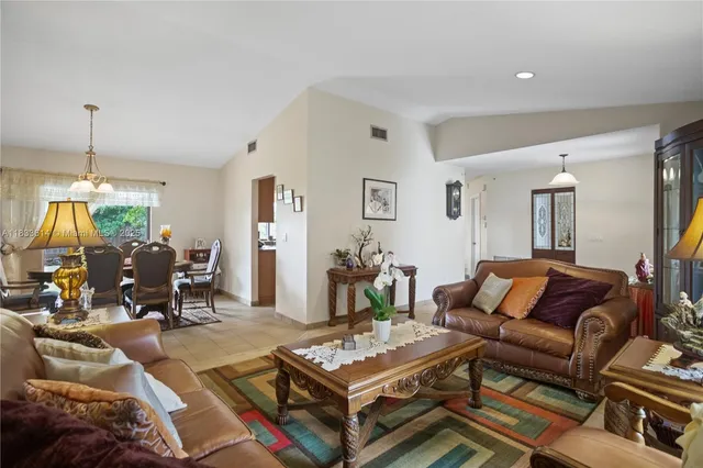 a living room with furniture and a table