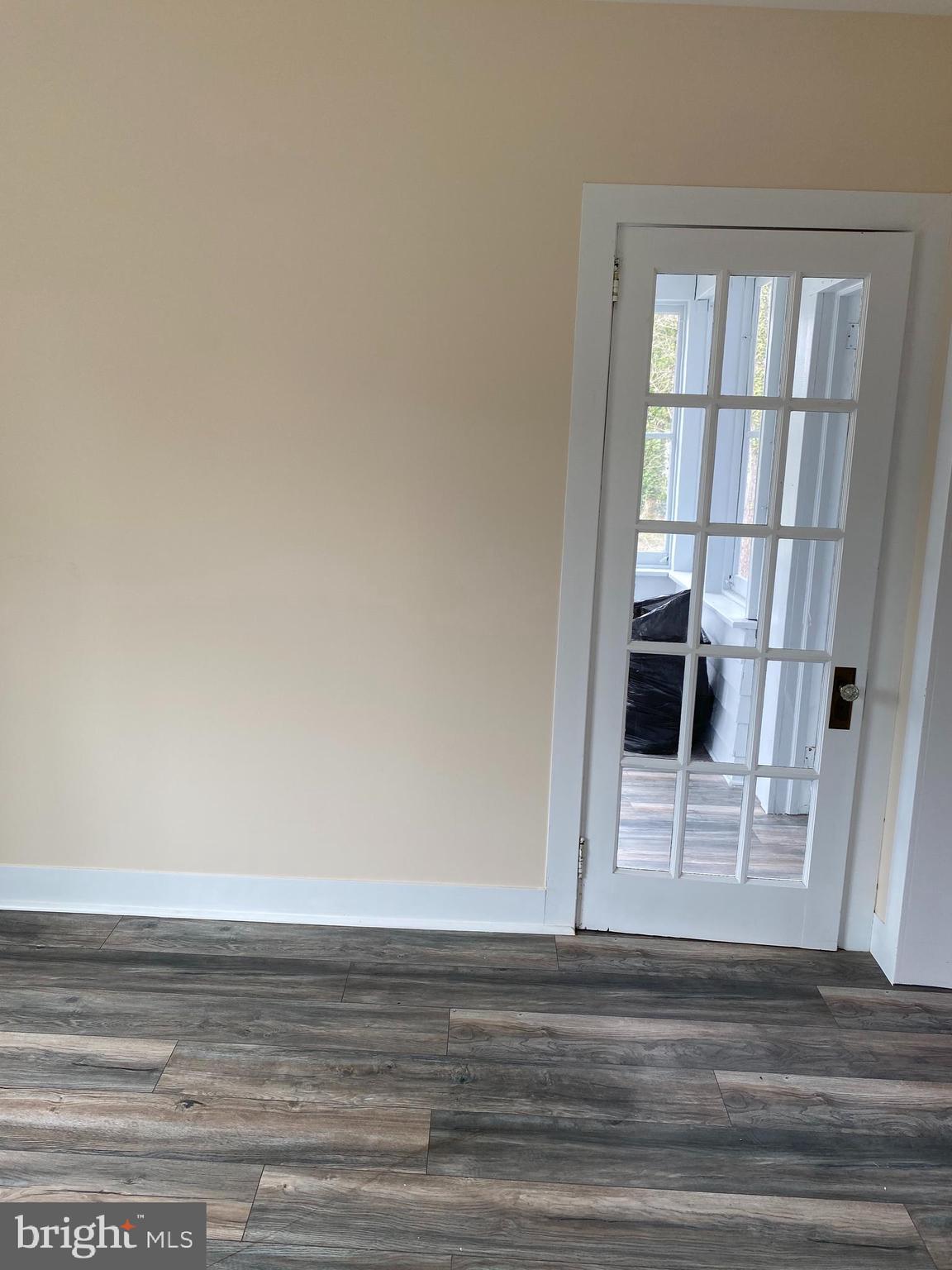 261 Berlin Road Clementon, NJ 08021 - Photo 19 of 45 main level bed with access door to enclosed porch