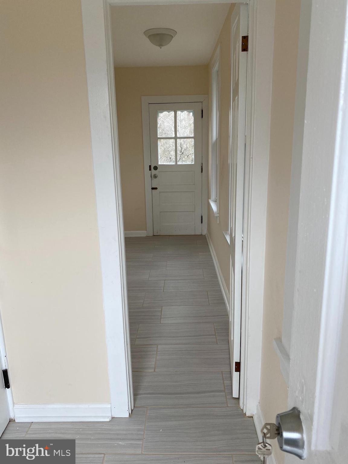 261 Berlin Road Clementon, NJ 08021 - Photo 5 of 45 foyer to main floor laundry and back door balcony