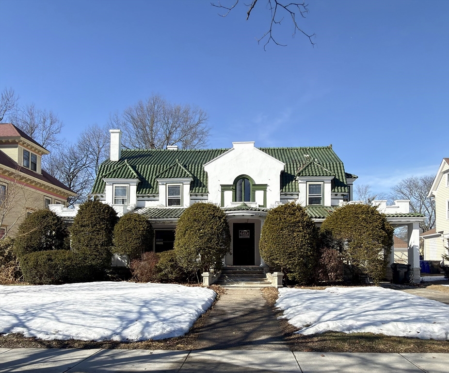 a front view of a house with a yard