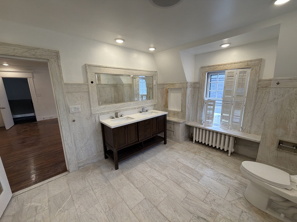 194 Sumner Avenue Springfield, MA 01108 - Photo 13 of 24 a spacious bedroom with a bed and a large window