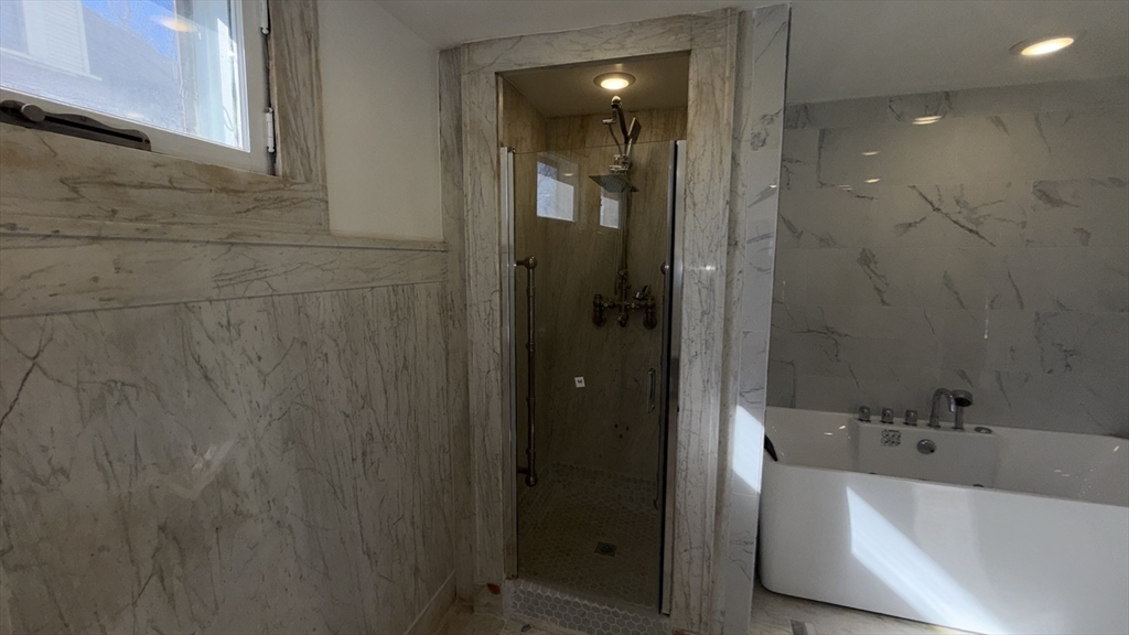 194 Sumner Avenue Springfield, MA 01108 - Photo 14 of 24 a bathroom with a tub sink shower and mirror