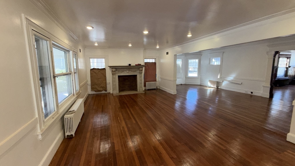 194 Sumner Avenue Springfield, MA 01108 - Photo 17 of 24 a view of empty room with wooden floor