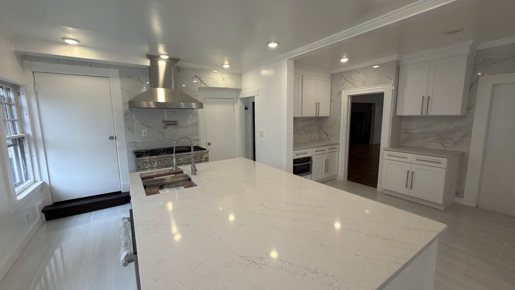 194 Sumner Avenue Springfield, MA 01108 - Photo 6 of 24 a kitchen with stainless steel appliances a refrigerator and a stove