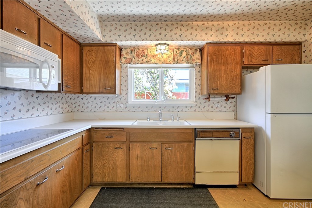 1659 Edgemont Drive Camarillo, CA 93010 - Photo 14 of 28 a kitchen with a sink cabinets and a refrigerator