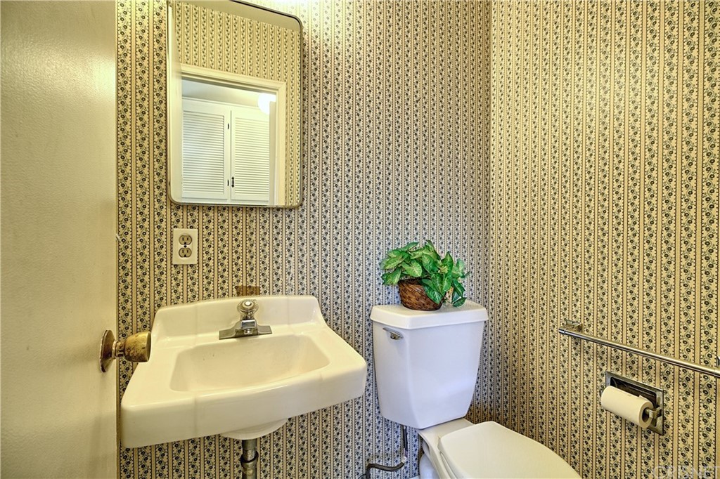 1659 Edgemont Drive Camarillo, CA 93010 - Photo 16 of 28 a bathroom with a sink toilet and a mirror
