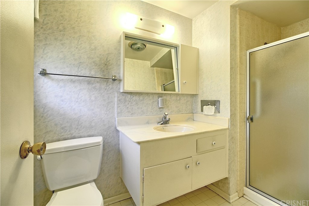 1659 Edgemont Drive Camarillo, CA 93010 - Photo 22 of 28 a bathroom with a toilet sink vanity and mirror
