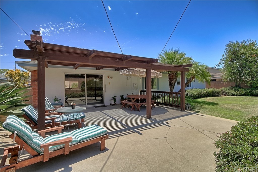 1659 Edgemont Drive Camarillo, CA 93010 - Photo 24 of 28 a view of a patio with table and chairs under an umbrella