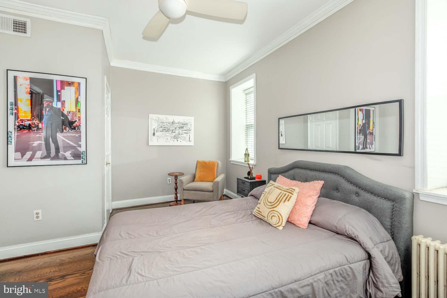 306 M Street Northwest Washington, DC 20001 - Photo 13 of 22 a bedroom with a bed and a painting on the wall