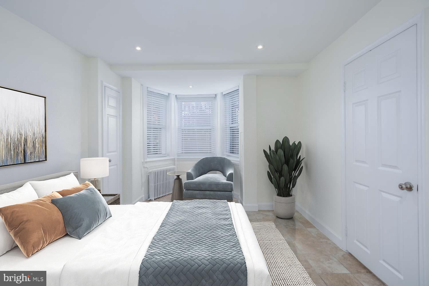 306 M Street Northwest Washington, DC 20001 - Photo 20 of 22 a bedroom with a bed and a large window