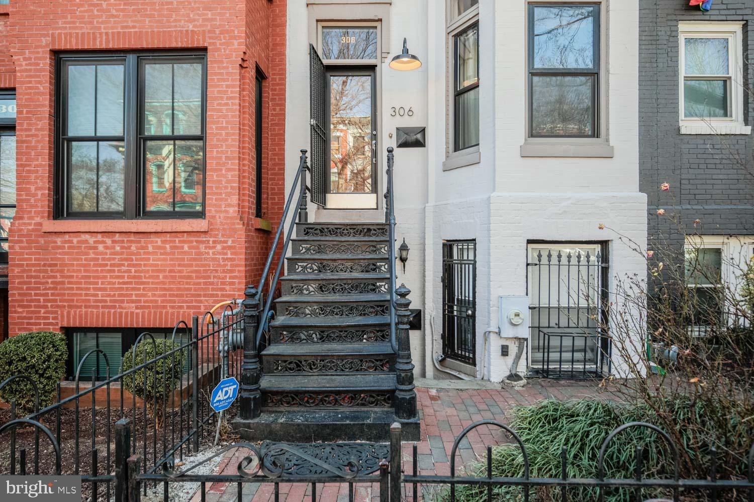 306 M Street Northwest Washington, DC 20001 - Photo 2 of 22 a front view of a house with a garden