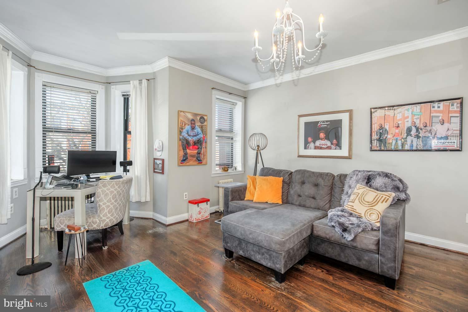 306 M Street Northwest Washington, DC 20001 - Photo 10 of 22 a living room with furniture and a flat screen tv