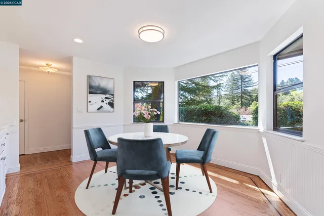 a kitchen with white cabinets and appliances