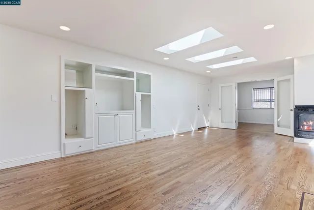 a view of a livingroom with wooden floor