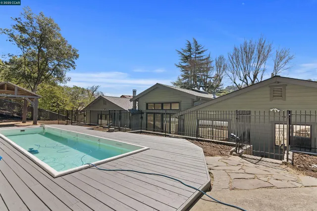 a view of a swimming pool with a patio