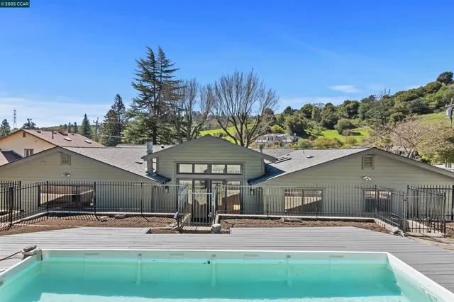a view of a house with a tree