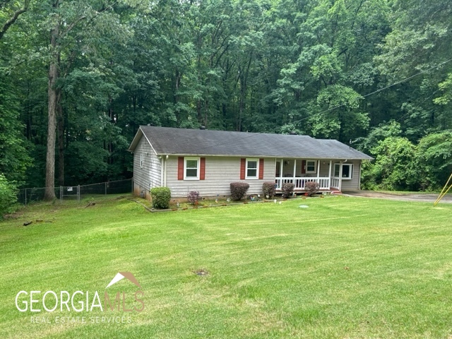 156 Springvalley Circle Stockbridge, GA 30281 - Photo 1 of 1 a front view of a house with a garden