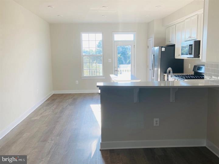 2640 Jetstream Road Herndon, VA 20171 - Photo 11 of 20 an empty room with wooden floor and windows