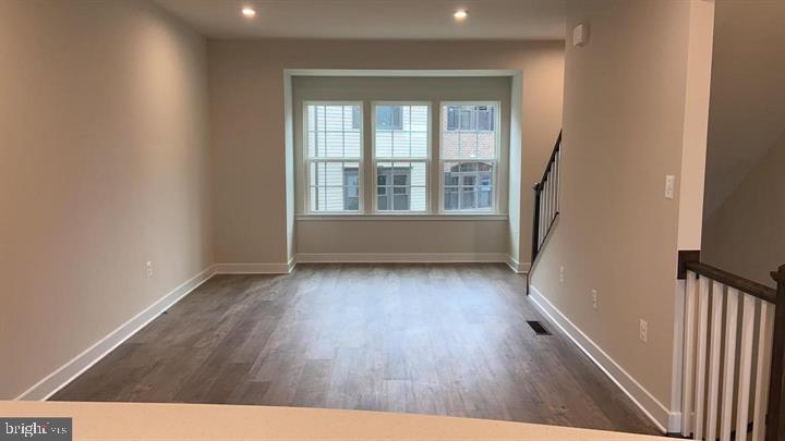 2640 Jetstream Road Herndon, VA 20171 - Photo 12 of 20 wooden floor in an empty room with a window