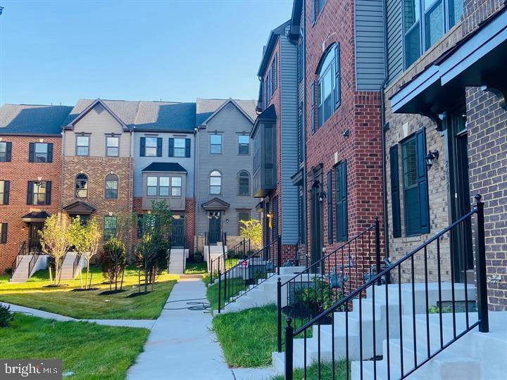 2640 Jetstream Road Herndon, VA 20171 - Photo 19 of 20 a front view of a house with a yard table and chairs