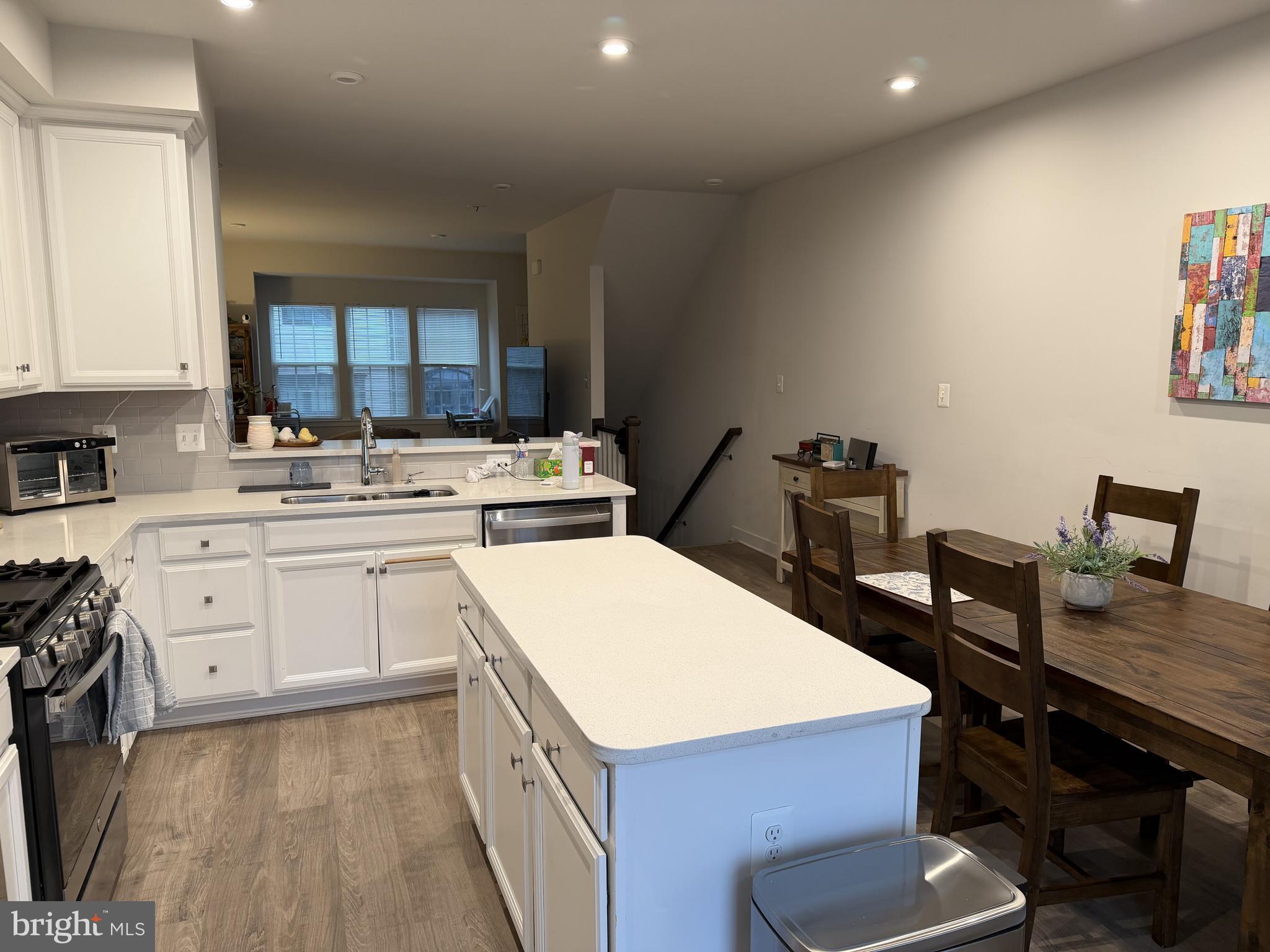 2640 Jetstream Road Herndon, VA 20171 - Photo 6 of 20 a kitchen with a sink a stove and chairs