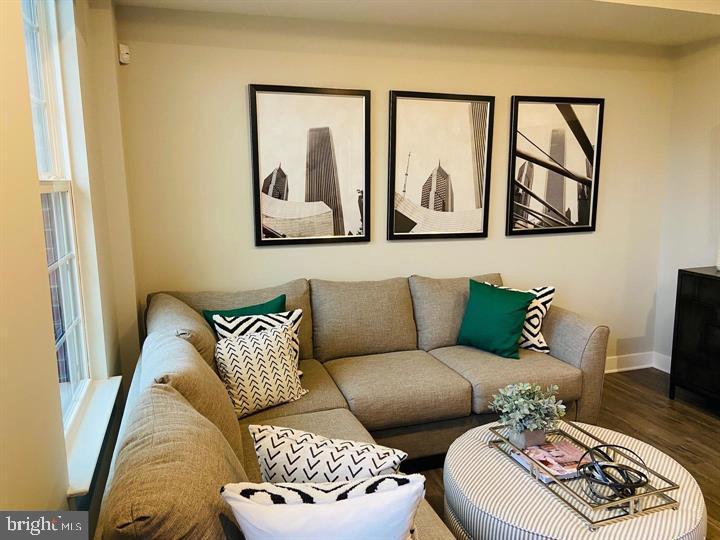 2640 Jetstream Road Herndon, VA 20171 - Photo 8 of 20 a living room with furniture and a painting on the wall