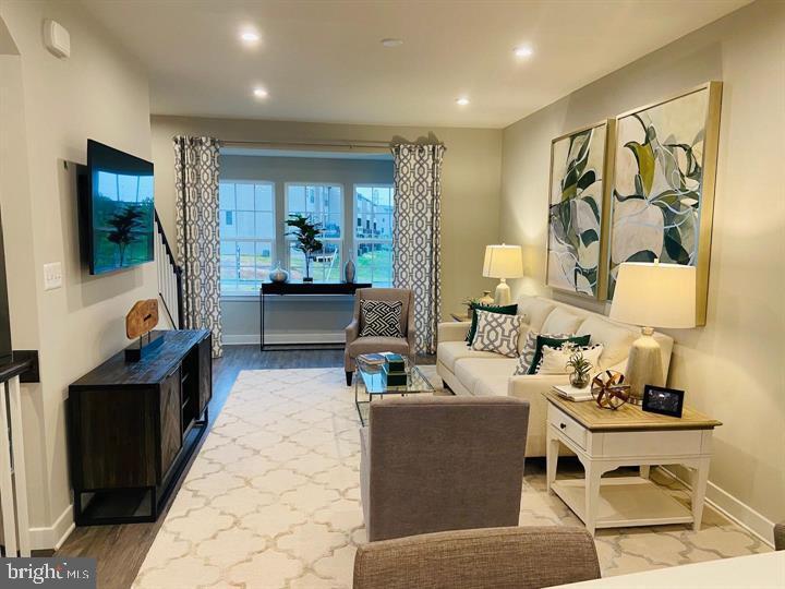 2640 Jetstream Road Herndon, VA 20171 - Photo 9 of 20 a living room with furniture and a flat screen tv