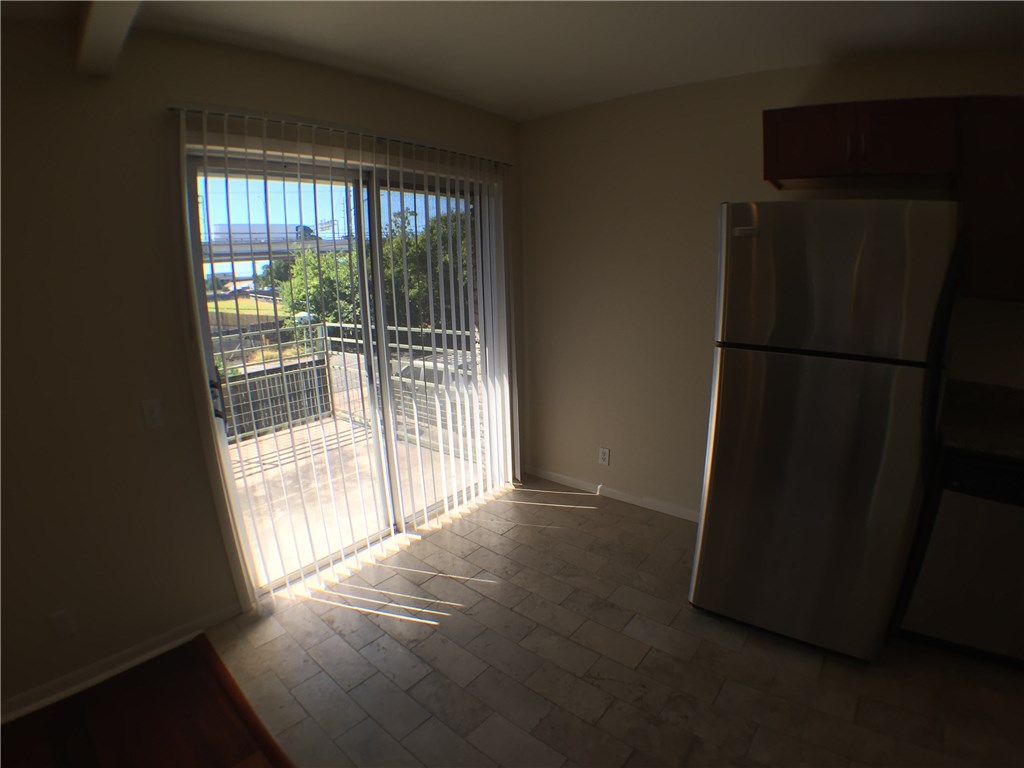 2800 Cole Street, Unit 201C Austin, TX 78705 - Photo 8 of 16 a view of empty room with wooden floor and fan