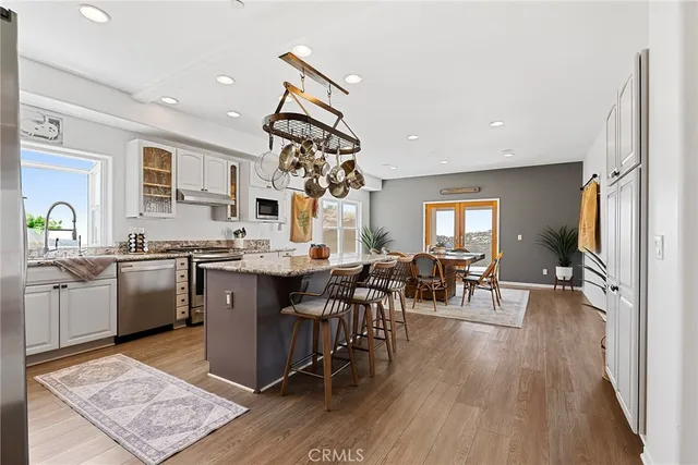 a view of kitchen with furniture and wooden floor