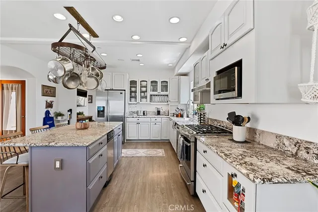 a living room with furniture a ceiling fan and a window