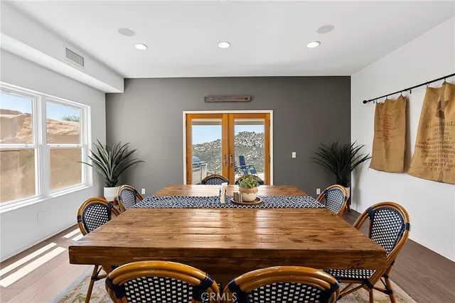 a large white kitchen with a large window