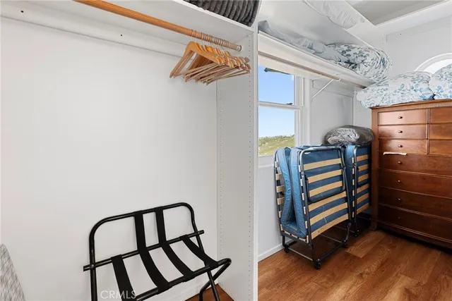 a view of a hallway with paintings on the wall