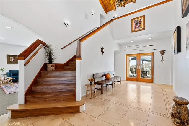 a view of a dining room with furniture and a floor to ceiling window