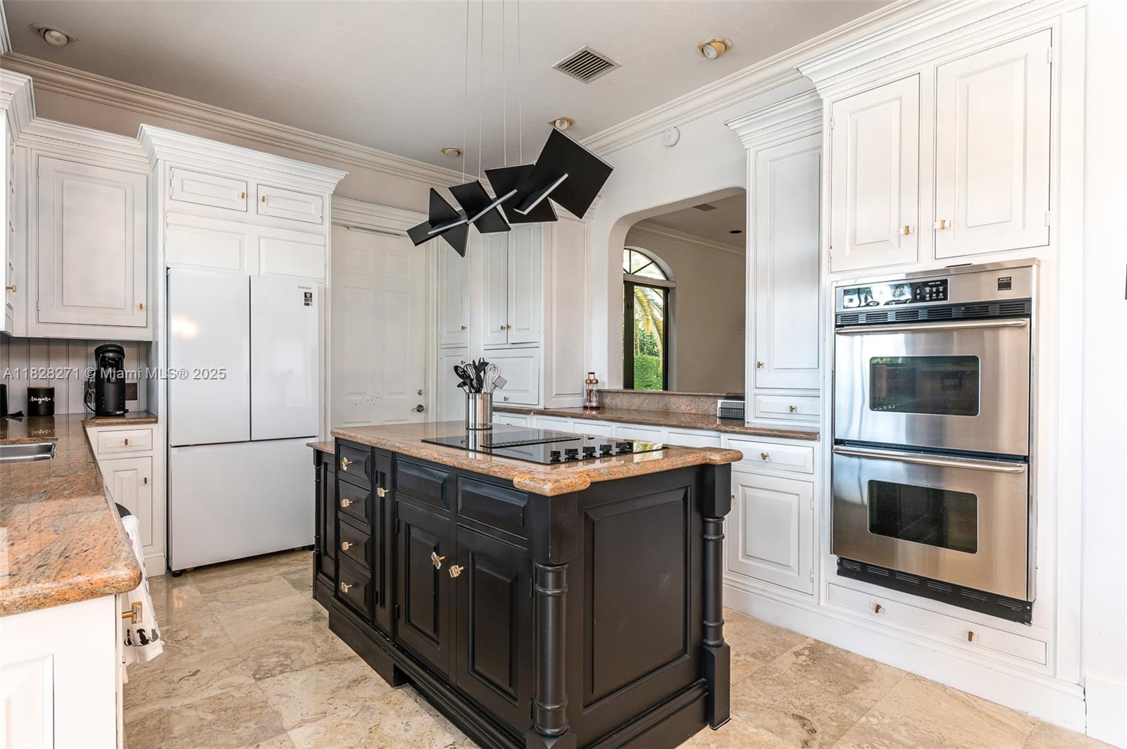 Las Olas Isles Fort Lauderdale, FL 33301 - Photo 13 of 29 a kitchen with stainless steel appliances granite countertop a stove a sink and a refrigerator
