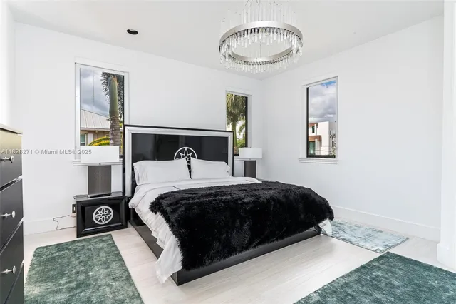 a bedroom with a bed and a night stand