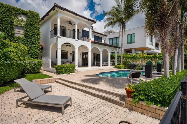 a front view of building with yard and green space