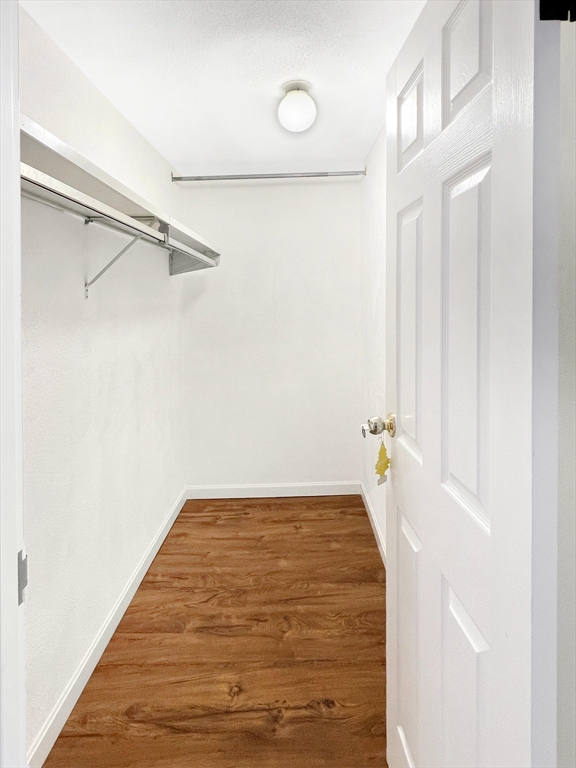 9 Broadway, Unit 210 Saugus, MA 01906 - Photo 16 of 24 a view of empty room with wooden floor