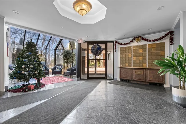 a spacious bedroom with a bed and a large window