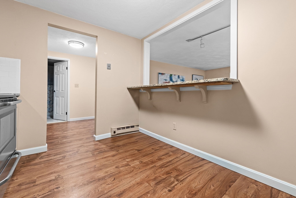 9 Broadway, Unit 210 Saugus, MA 01906 - Photo 23 of 24 a view of a room with wooden floor