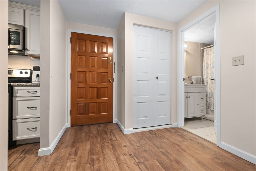 9 Broadway, Unit 210 Saugus, MA 01906 - Photo 10 of 24 wooden floor and closet in a room