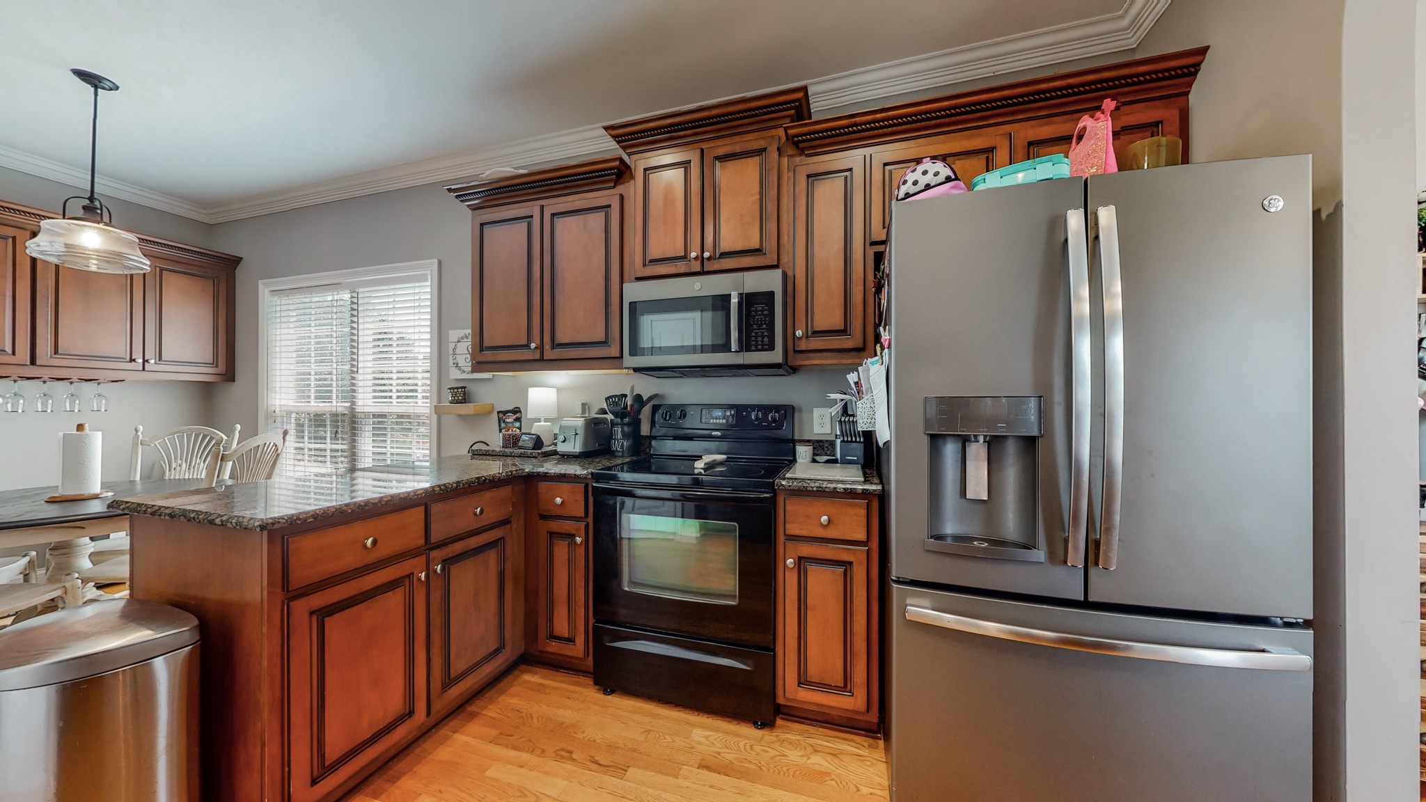 727 Heritage Road Lebanon, TN 37087 - Photo 36 of 58 a kitchen with stainless steel appliances granite countertop a refrigerator a stove top oven a sink and dishwasher