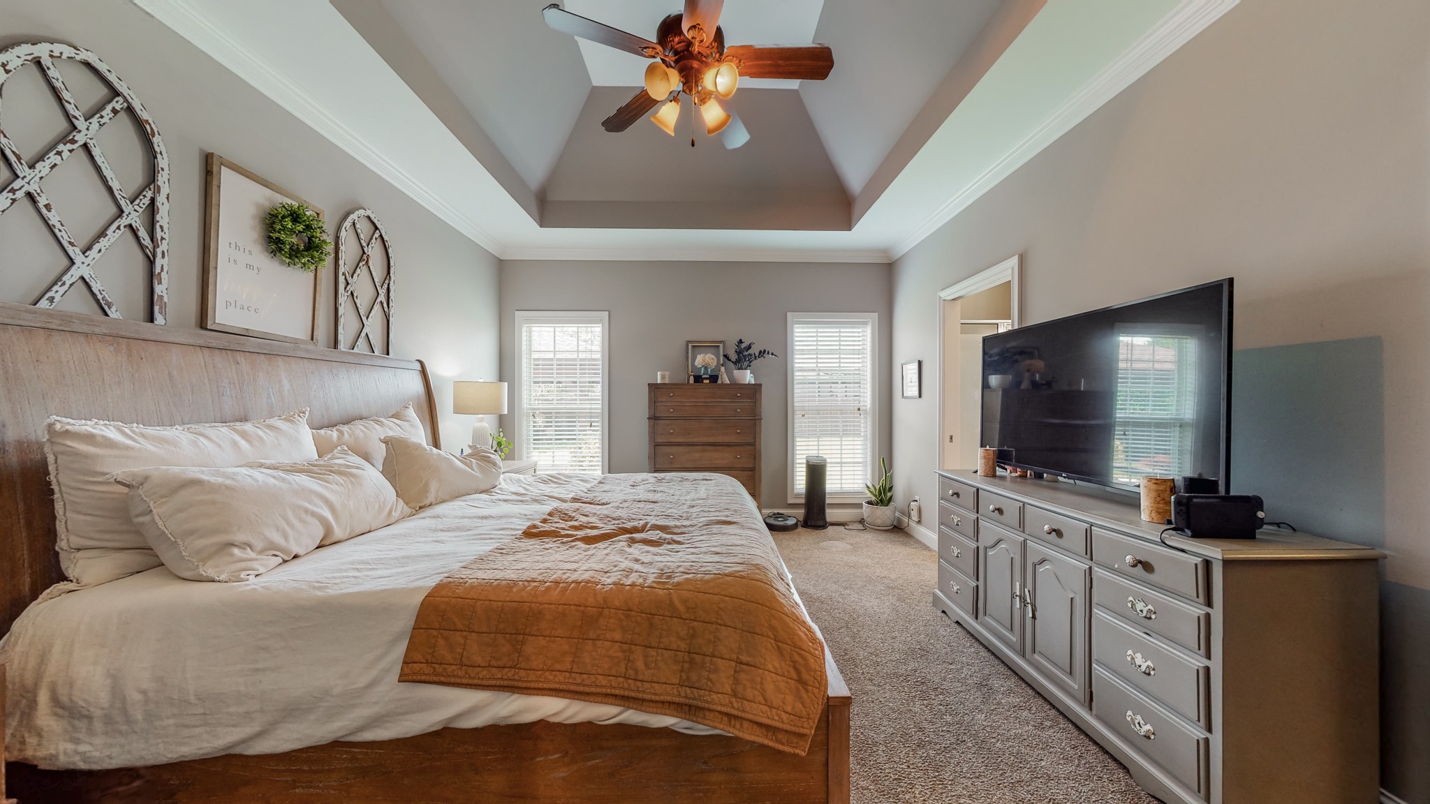 727 Heritage Road Lebanon, TN 37087 - Photo 47 of 58 a spacious bedroom with a bed and a flat screen tv