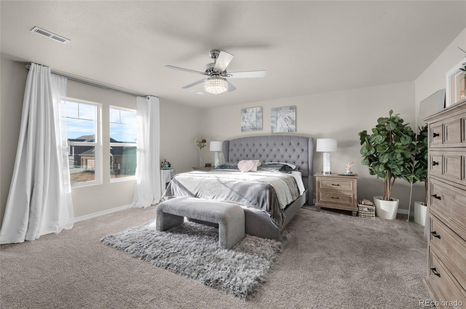9033 Yellowtail Way Colorado Springs, CO 80908 - Photo 20 of 39 a bedroom with a bed and a window
