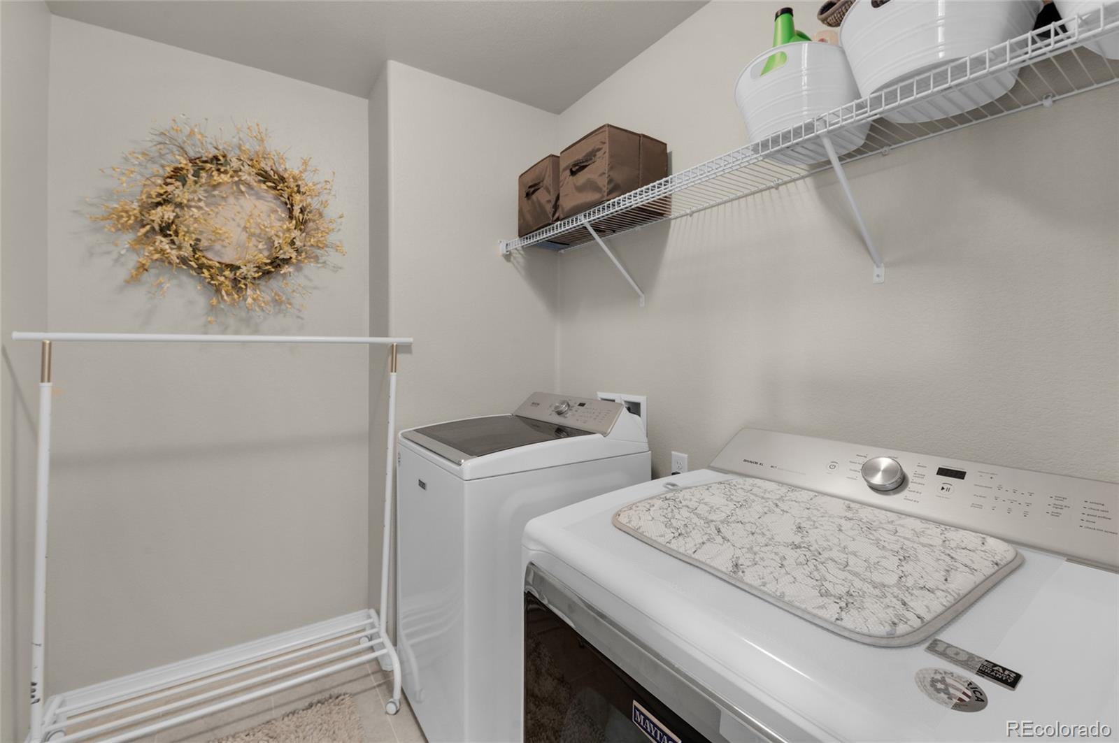 9033 Yellowtail Way Colorado Springs, CO 80908 - Photo 31 of 39 a utility room with dryer and washer